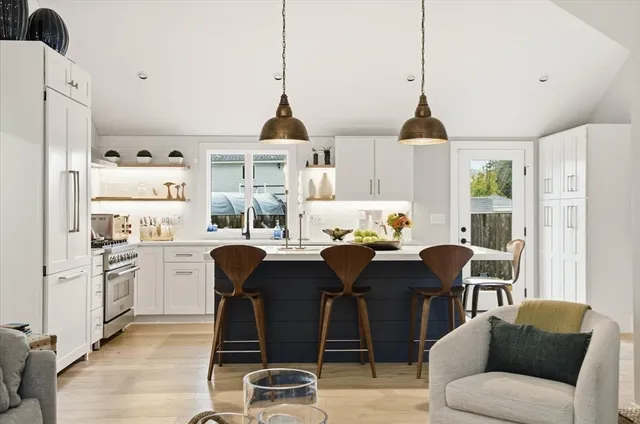 a view of kitchen with cabinets and wooden floor