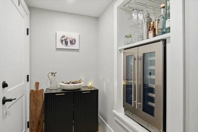 a room that has a dresser in it