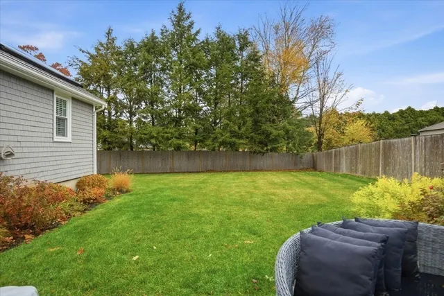 a view of backyard with seating space