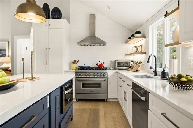 a kitchen with a sink stove and cabinets