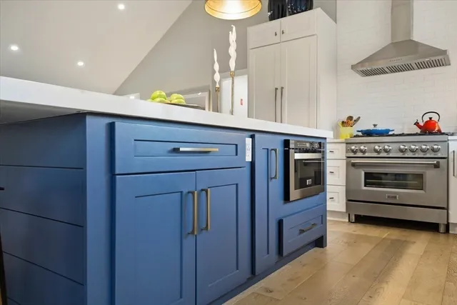 a kitchen with stainless steel appliances a stove and a refrigerator