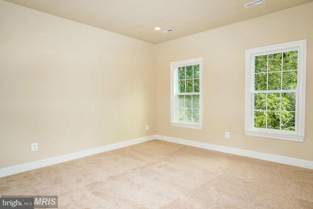 8536 Old Keene Mill Road Springfield, VA 22152 - Photo 16 of 30 an empty room with a window