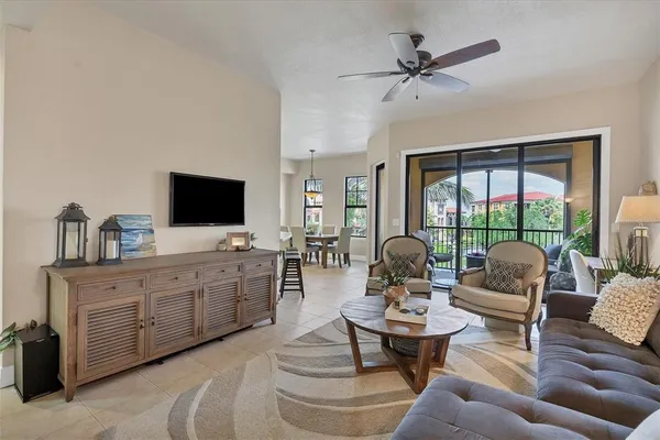 a living room with furniture and a large window