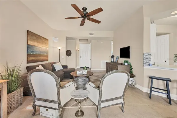 a living room with furniture and a window