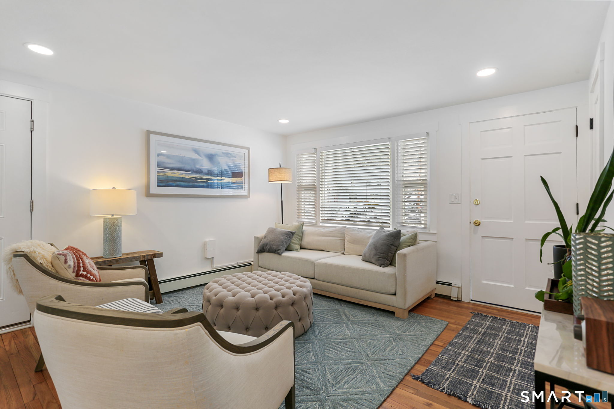 1353 Mill Plain Road Fairfield, CT 06824 - Photo 11 of 37 a living room with furniture and a potted plant