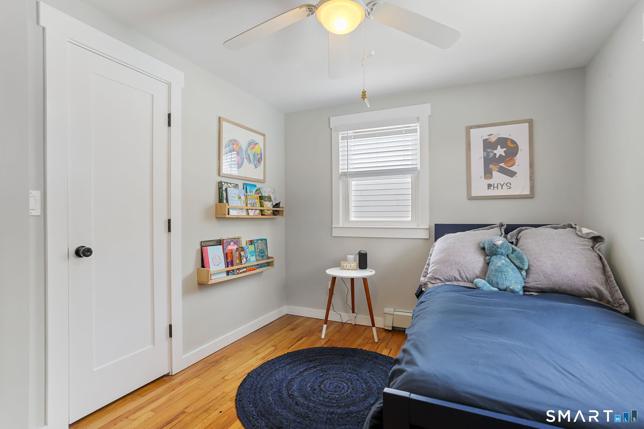 1353 Mill Plain Road Fairfield, CT 06824 - Photo 17 of 37 a bed room with a bed and a chair