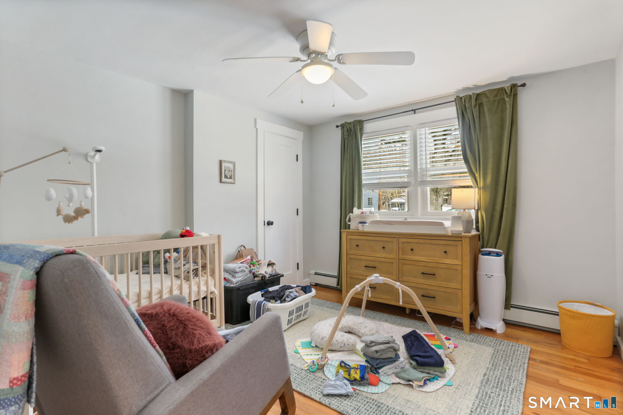 1353 Mill Plain Road Fairfield, CT 06824 - Photo 18 of 37 a living room with furniture and a fireplace