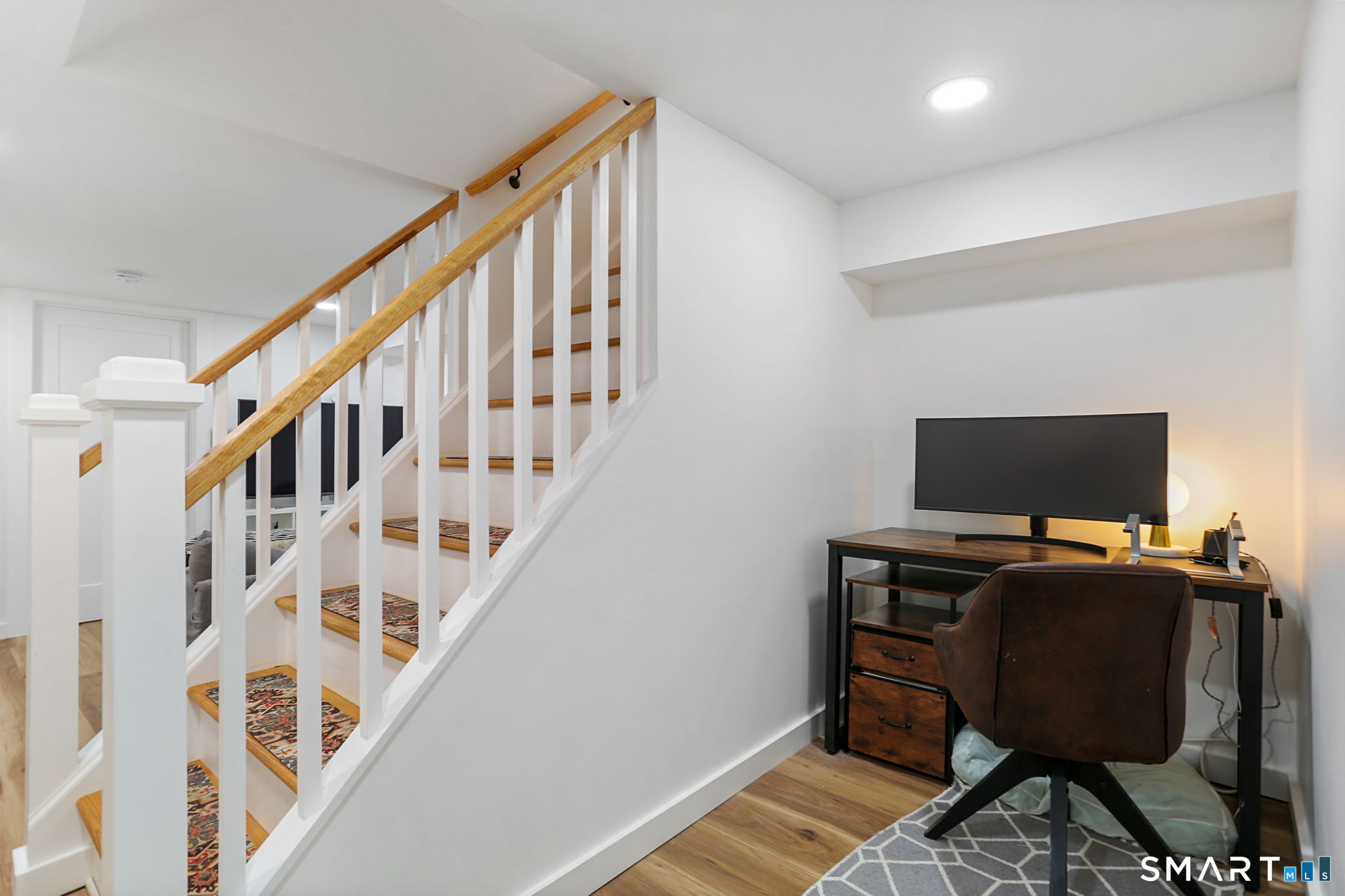 1353 Mill Plain Road Fairfield, CT 06824 - Photo 21 of 37 a view of a workspace with furniture and stairs