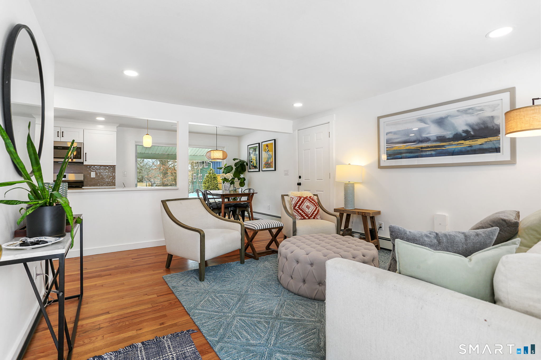 1353 Mill Plain Road Fairfield, CT 06824 - Photo 6 of 37 a living room with furniture and a potted plant