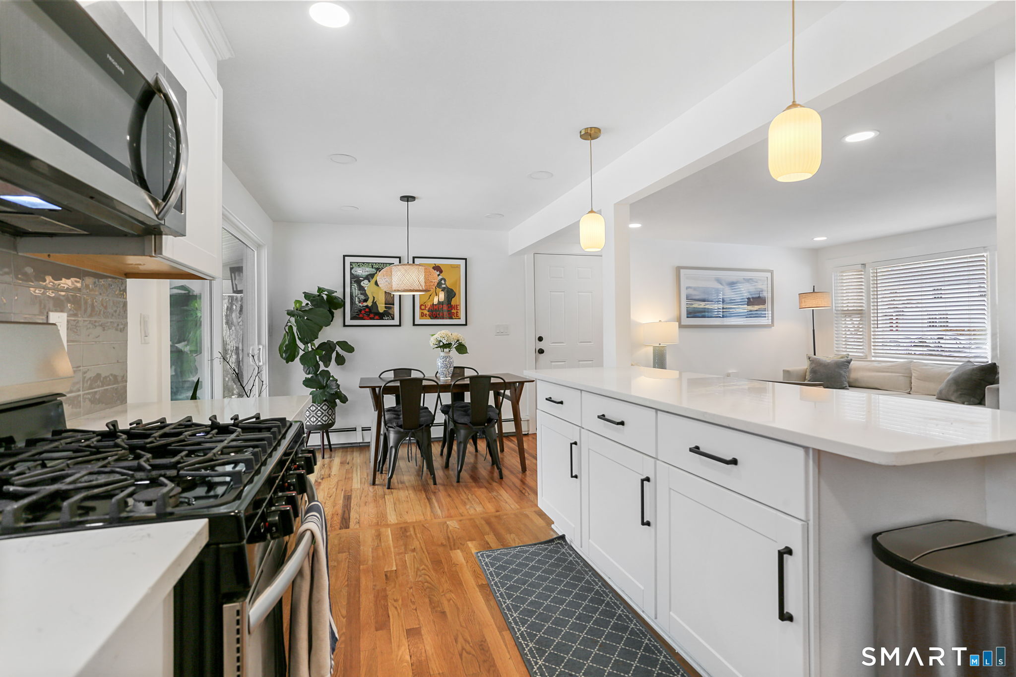 1353 Mill Plain Road Fairfield, CT 06824 - Photo 8 of 37 a kitchen with sink stove and cabinets