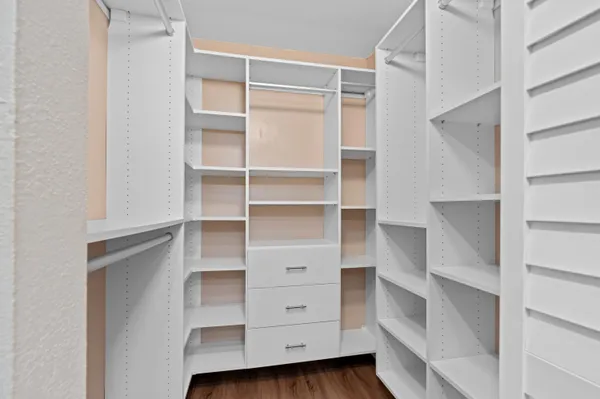 a view of an empty walk in closet