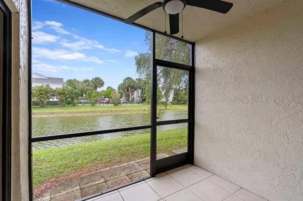 a view of a porch with a floor to ceiling window fire place