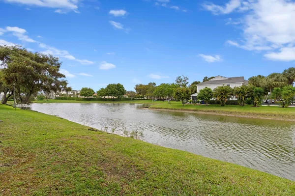 a view of a lake with houses in the back