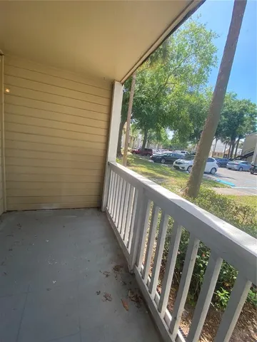 a view of a small yard in front of a house with a yard