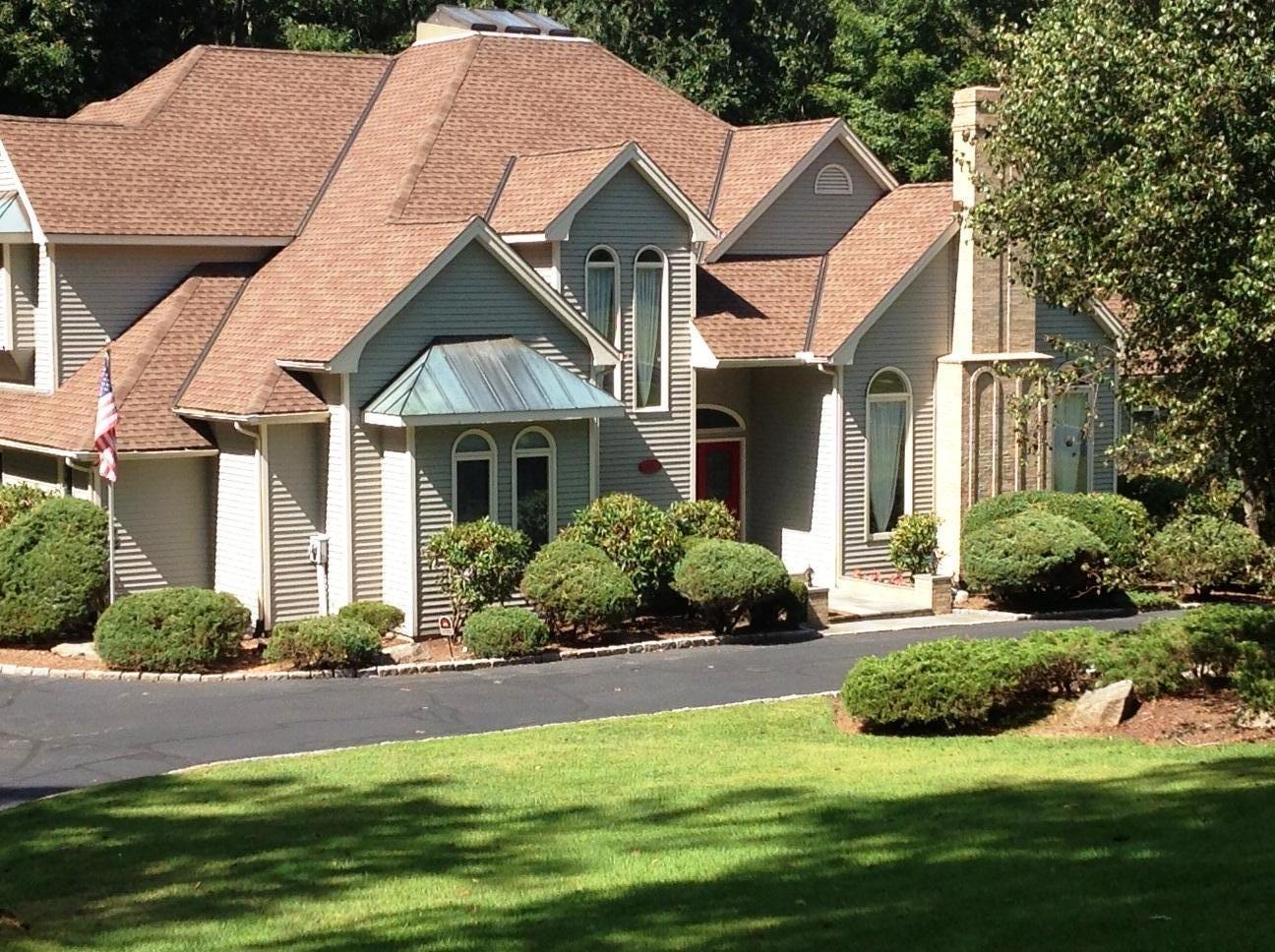 78 Catbrier Road Weston, CT 06883 - Photo 1 of 1 an aerial view of a house with a garden