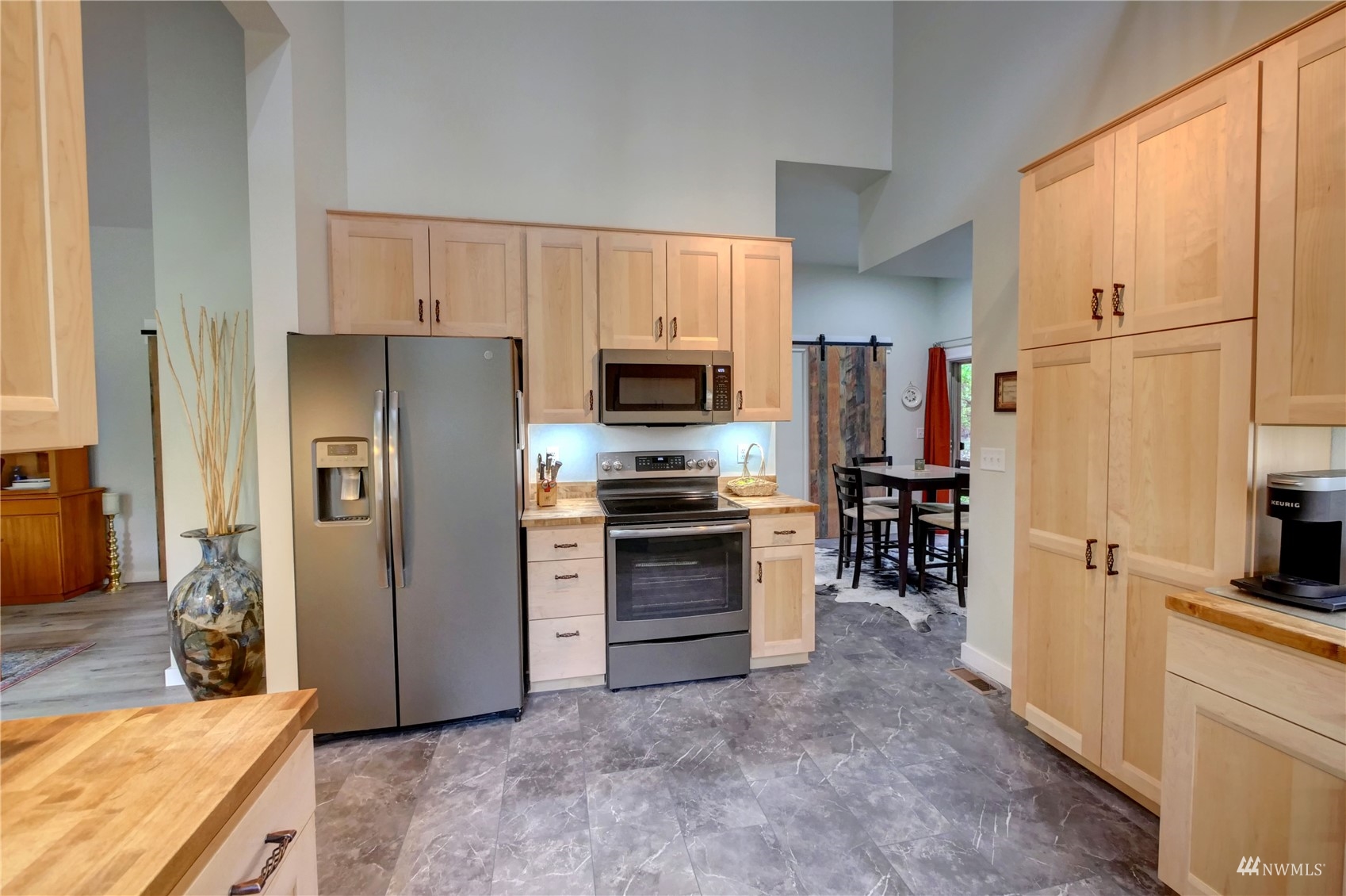 155 Twisp River Road Twisp, WA 98856 - Photo 11 of 39 a kitchen with stainless steel appliances granite countertop a refrigerator stove and oven
