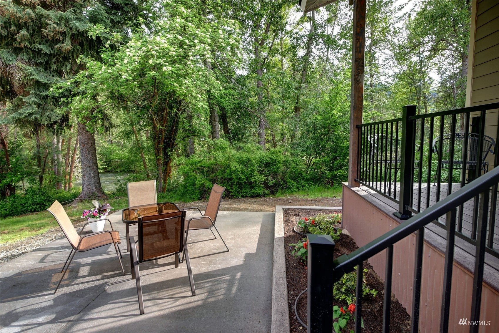 155 Twisp River Road Twisp, WA 98856 - Photo 25 of 39 a view of deck with furniture and trees