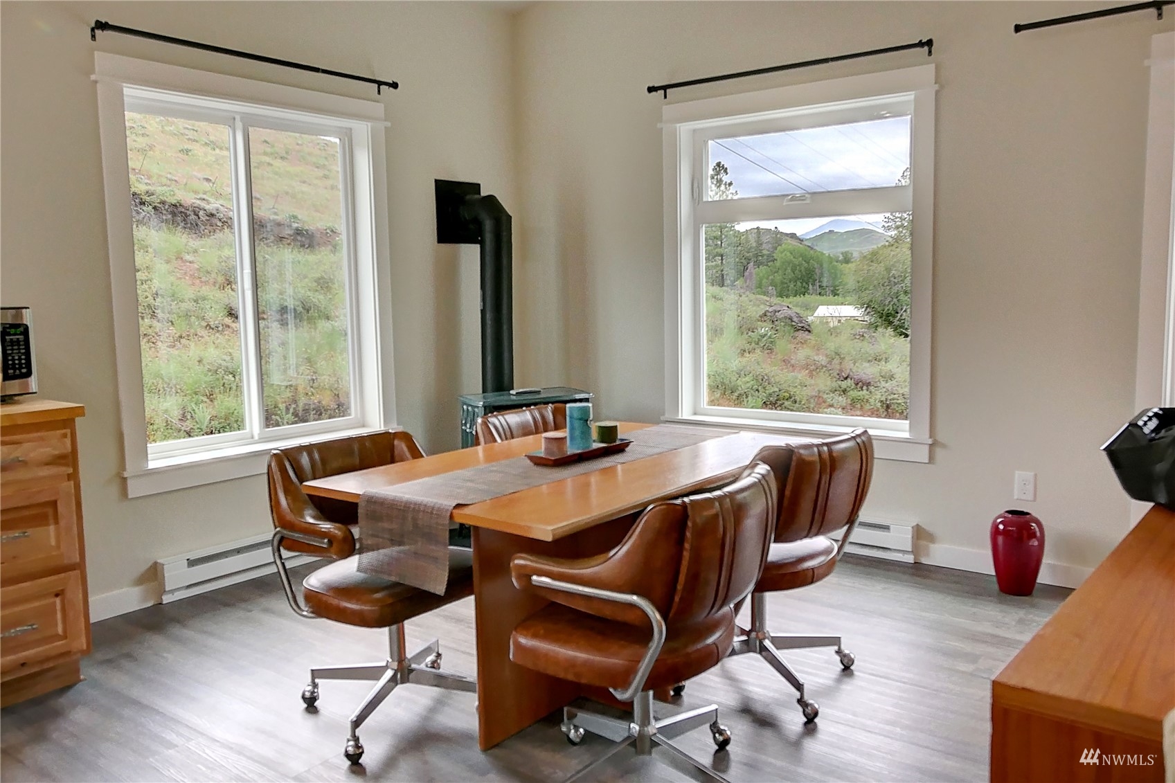 155 Twisp River Road Twisp, WA 98856 - Photo 33 of 39 a view of a dining room with a table and chairs