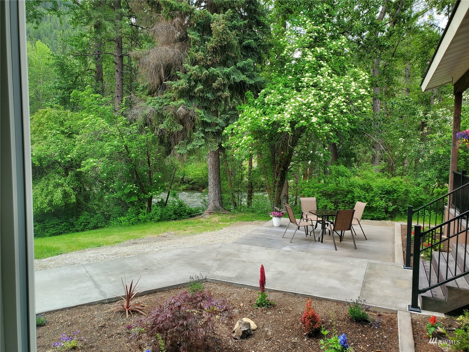 155 Twisp River Road Twisp, WA 98856 - Photo 5 of 39 a view of a patio with a table and chairs