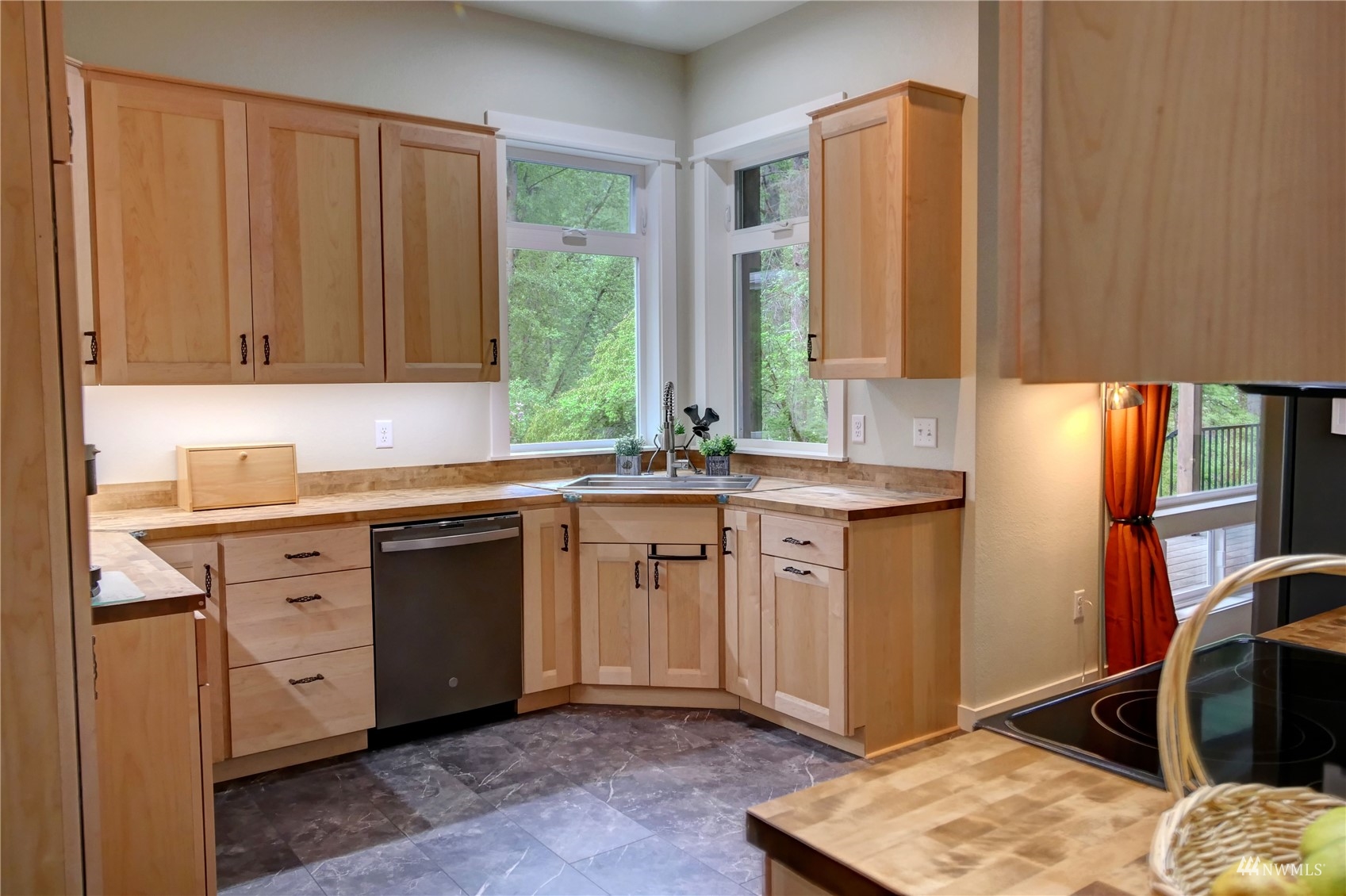 155 Twisp River Road Twisp, WA 98856 - Photo 10 of 39 a kitchen with stainless steel appliances granite countertop a sink stove and cabinets