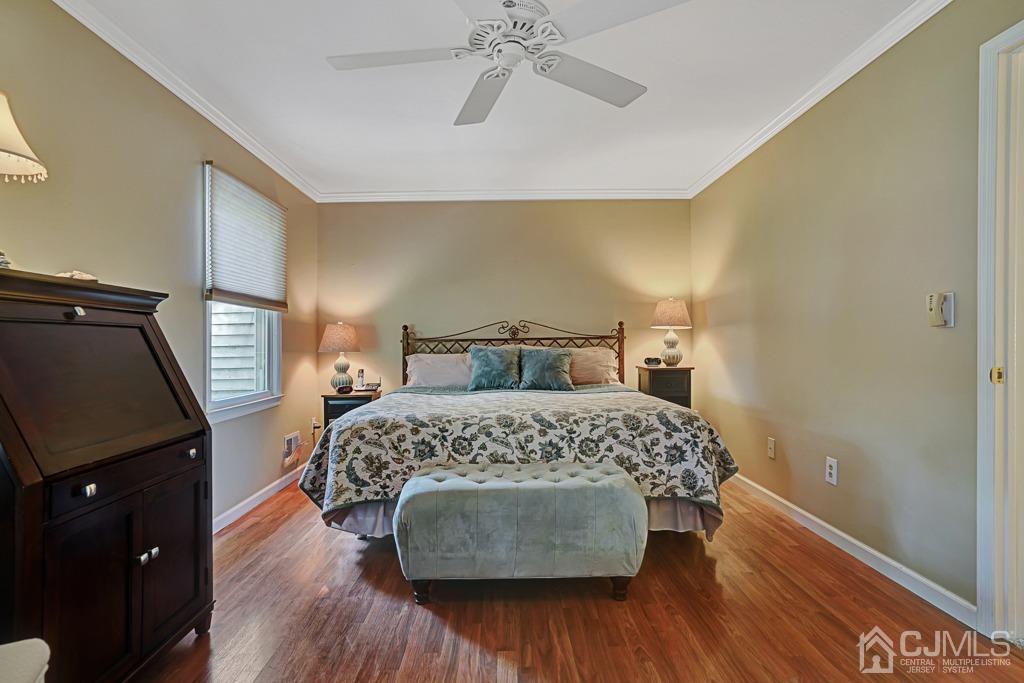 22 Hickory Court Middlesex, NJ 08846 - Photo 14 of 26 a bedroom with a bed and wooden floor