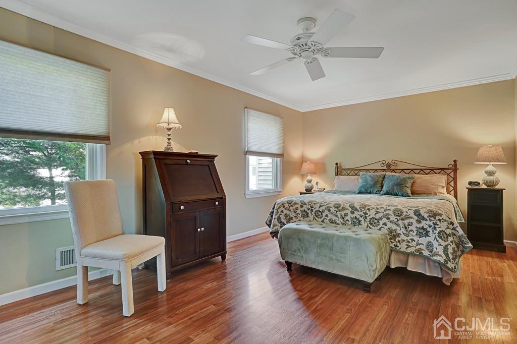22 Hickory Court Middlesex, NJ 08846 - Photo 15 of 26 a bedroom with a bed and wooden floor