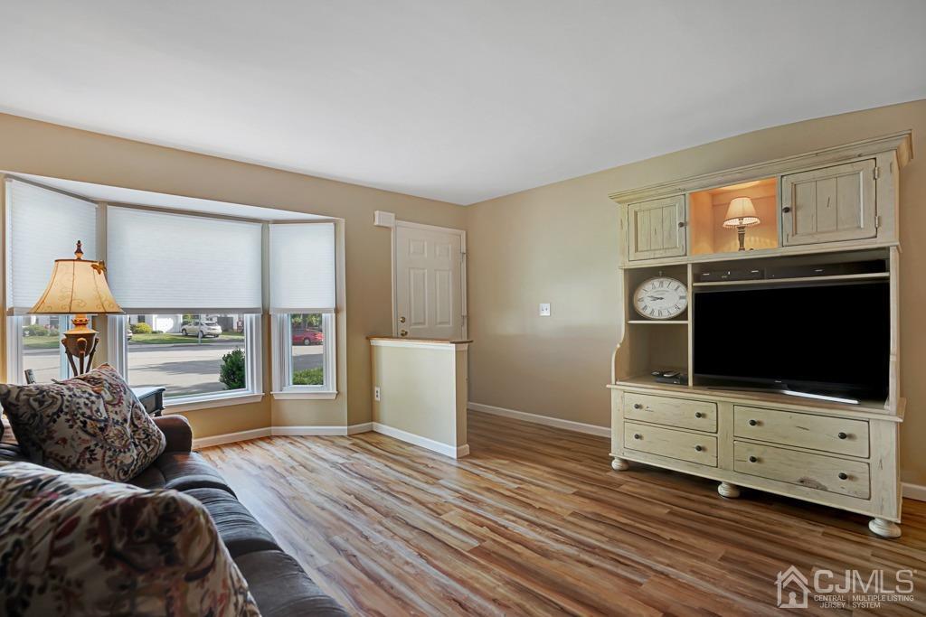 22 Hickory Court Middlesex, NJ 08846 - Photo 3 of 26 a living room with furniture and a flat screen tv