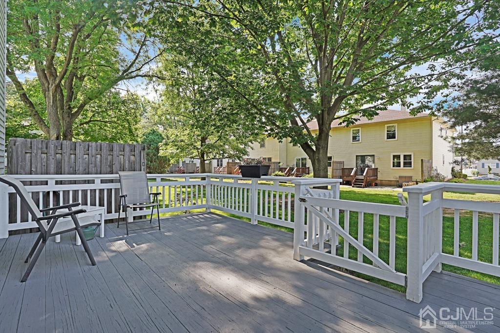 22 Hickory Court Middlesex, NJ 08846 - Photo 23 of 26 a view of a chair and table on the wooden deck