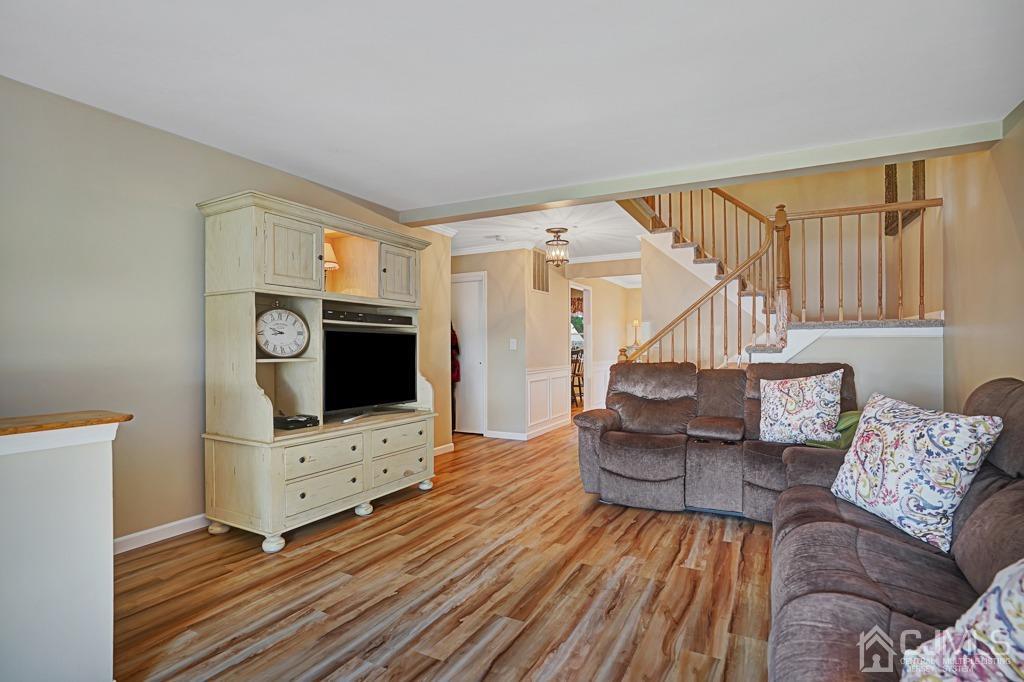 22 Hickory Court Middlesex, NJ 08846 - Photo 5 of 26 a living room with furniture and a flat screen tv