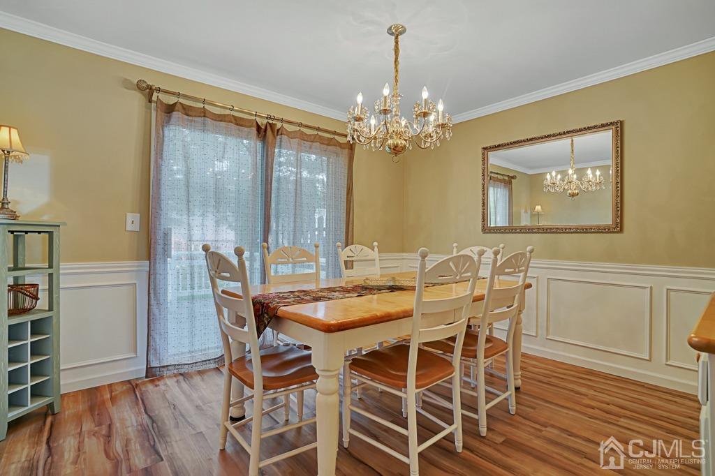 22 Hickory Court Middlesex, NJ 08846 - Photo 6 of 26 a view of a dining room with furniture and chandelier