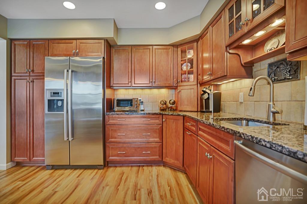 22 Hickory Court Middlesex, NJ 08846 - Photo 9 of 26 a kitchen with stainless steel appliances granite countertop a refrigerator and a sink