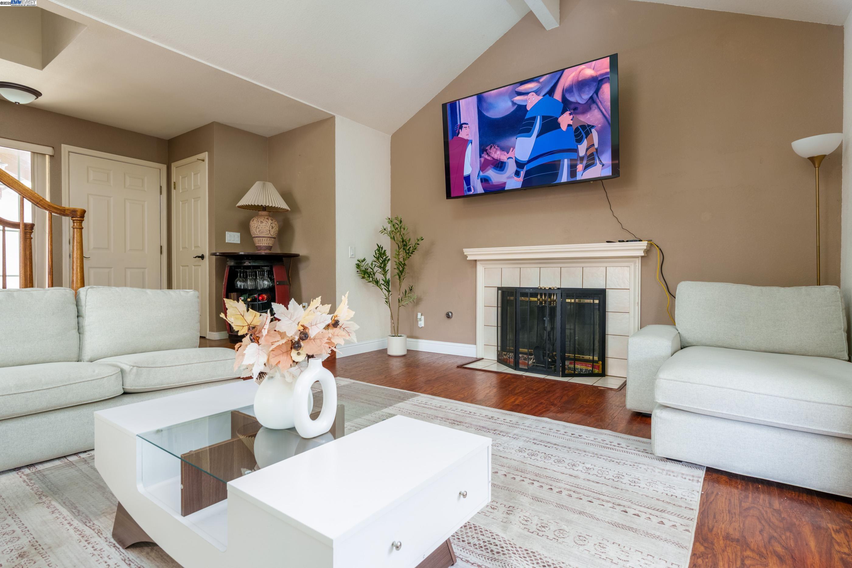7691 Church Street, Unit B Gilroy, CA 95020 - Photo 1 of 27 a living room with furniture and a fireplace
