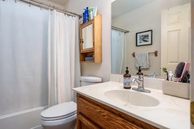 a kitchen with a stove a sink and a refrigerator