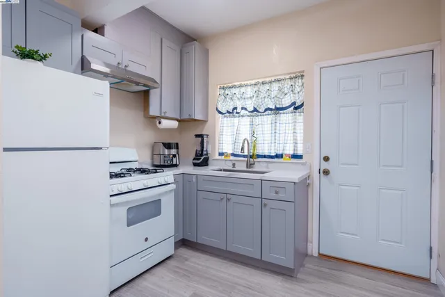 a living room with furniture and a chair