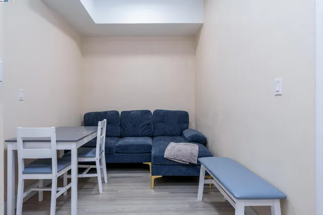 a kitchen with a refrigerator and a stove top oven