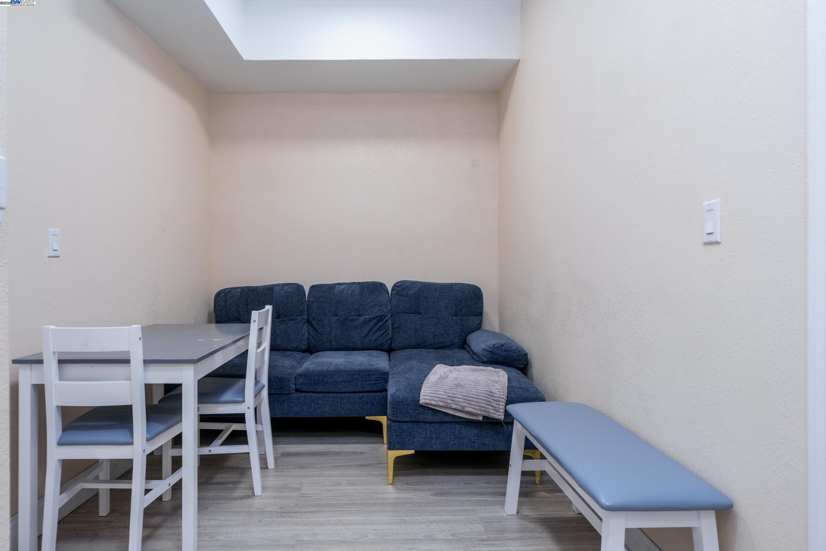 7691 Church Street, Unit B Gilroy, CA 95020 - Photo 24 of 27 a living room with furniture and a chair