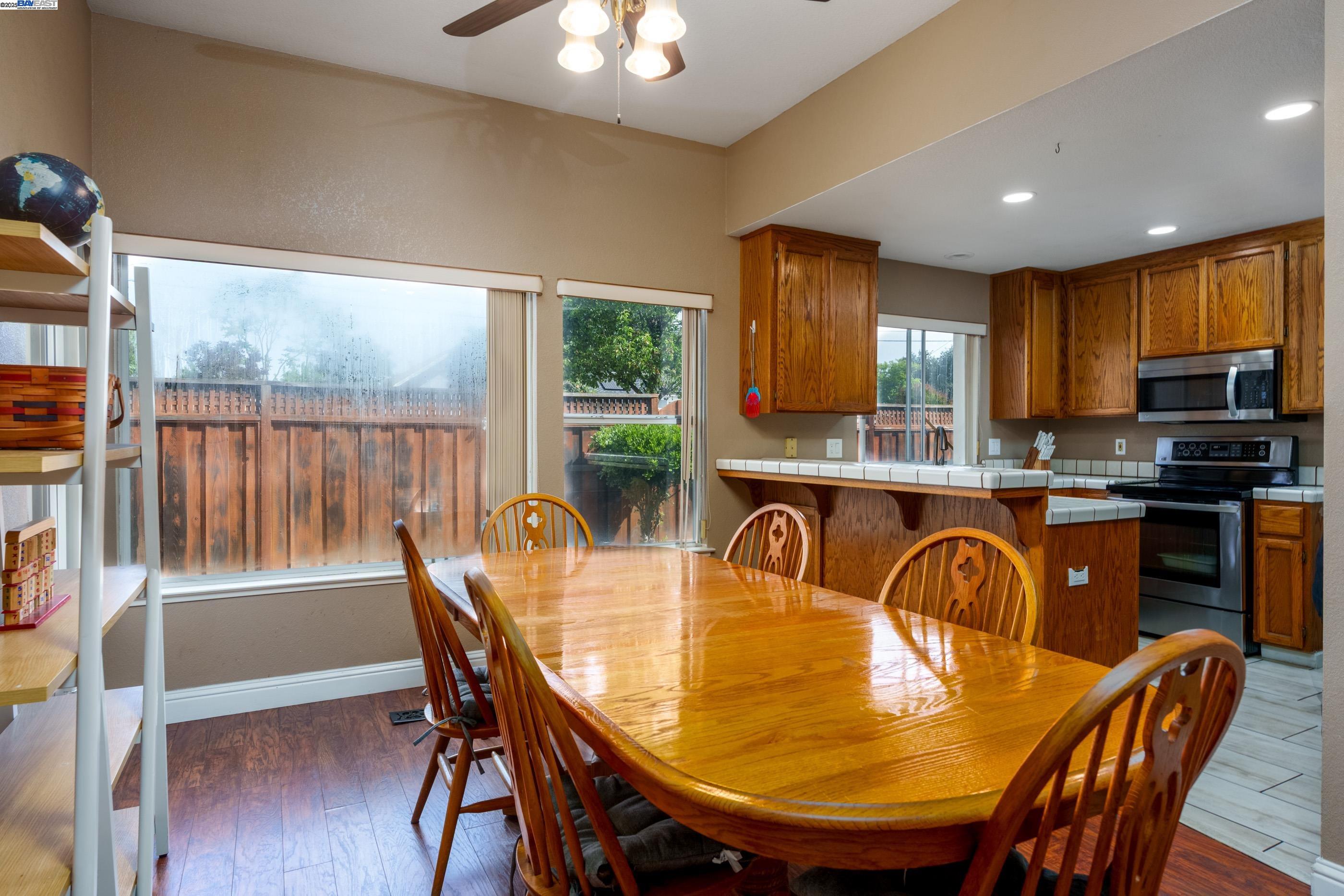 7691 Church Street, Unit B Gilroy, CA 95020 - Photo 10 of 27 a view of a dining room with furniture window and outside view