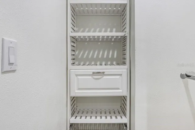 a kitchen with stainless steel appliances granite countertop a refrigerator sink and stove