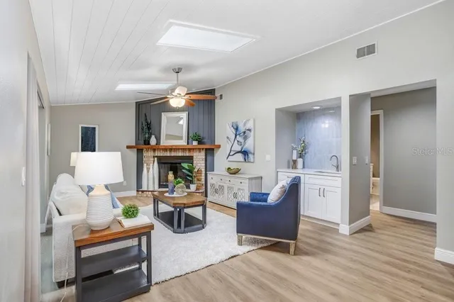 a kitchen with stainless steel appliances granite countertop a sink and cabinets