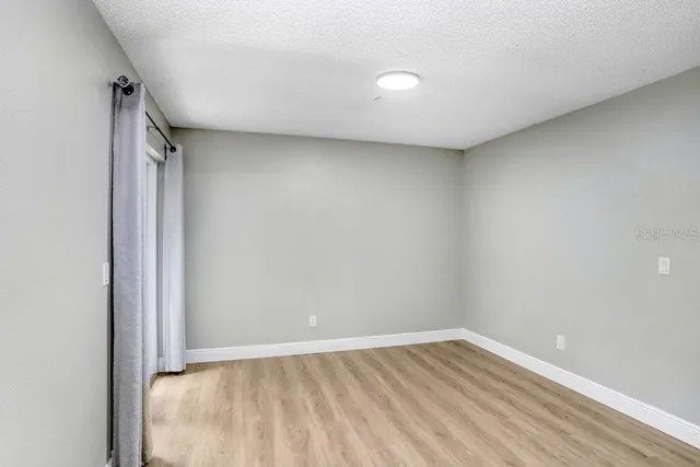 a view of a living hall with wooden floor