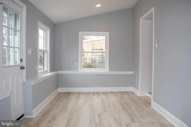 a view of room with window and hardwood floor