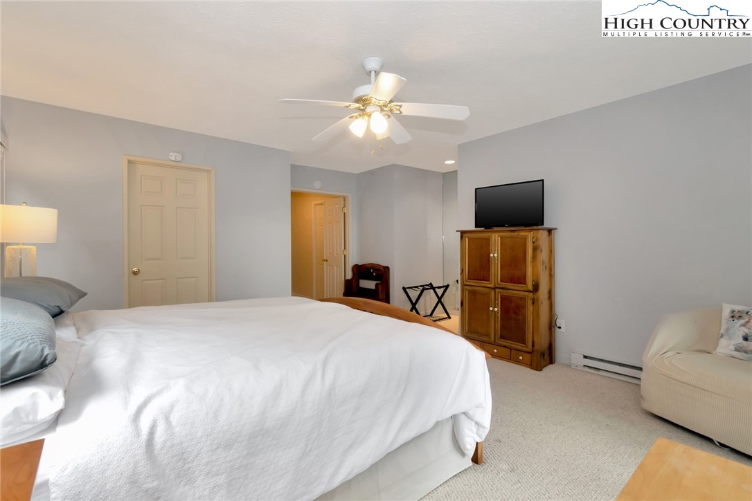 301 Pine Ridge Road Beech Mountain, NC 28604 - Photo 30 of 48 a bedroom with a bed and a tv