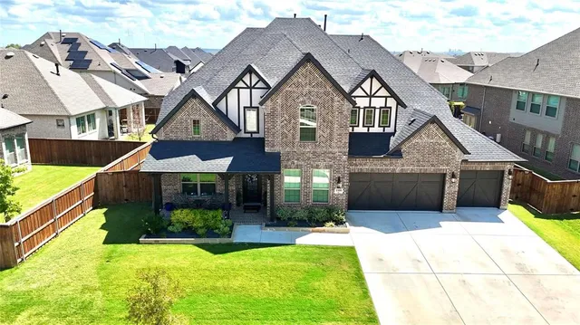 a aerial view of a house with swimming pool