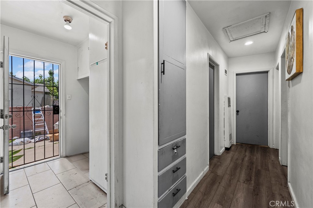 2725 East Tyler Street Carson, CA 90810 - Photo 16 of 30 a view of hallway with wooden floor