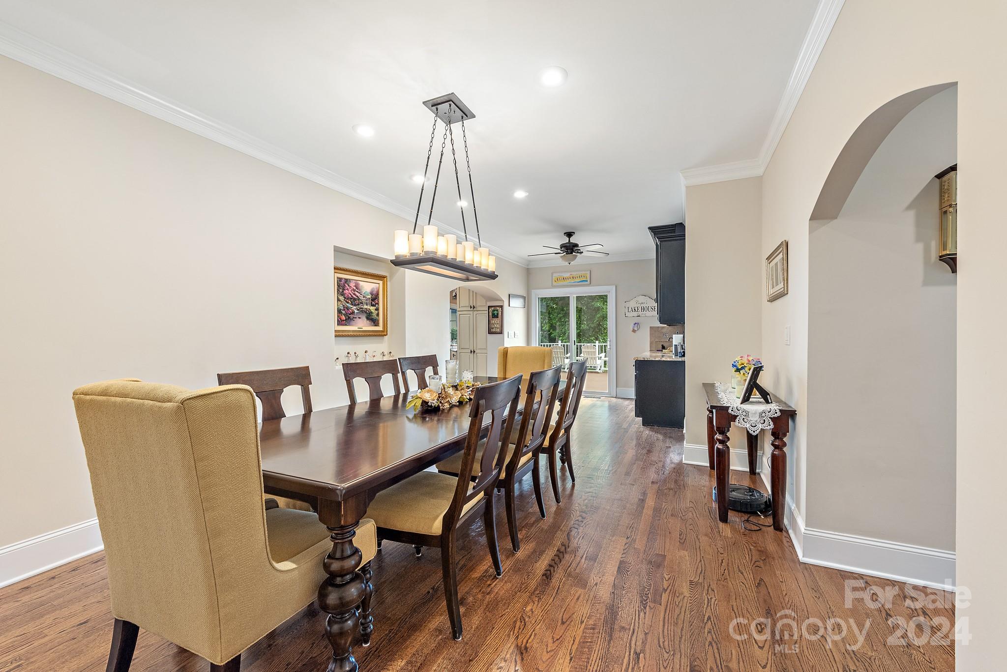 16711 Jetton Road Cornelius, NC 28031 - Photo 11 of 27 a view of a dining room with furniture and wooden floor