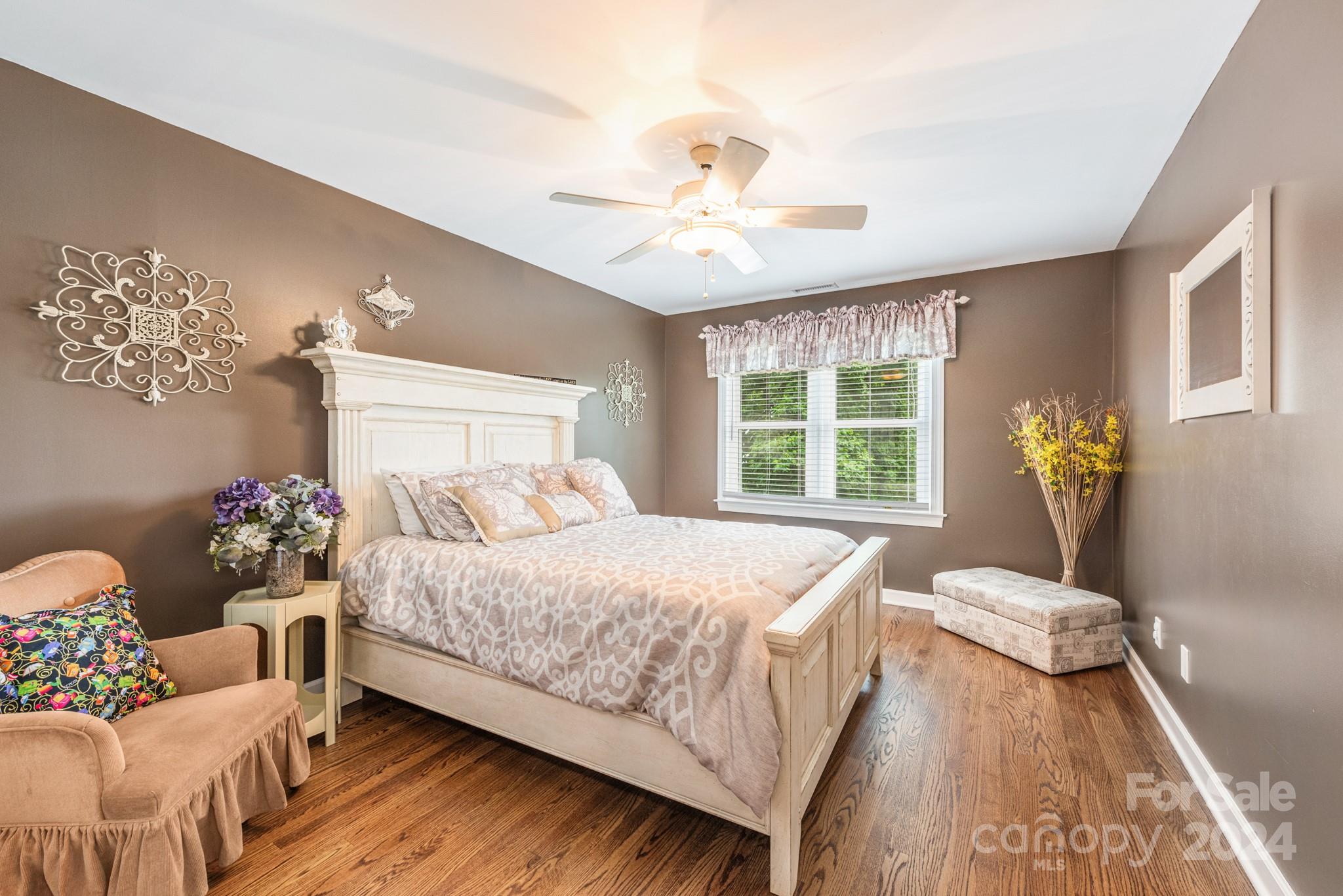 16711 Jetton Road Cornelius, NC 28031 - Photo 19 of 27 a bedroom with a bed and ceiling fan