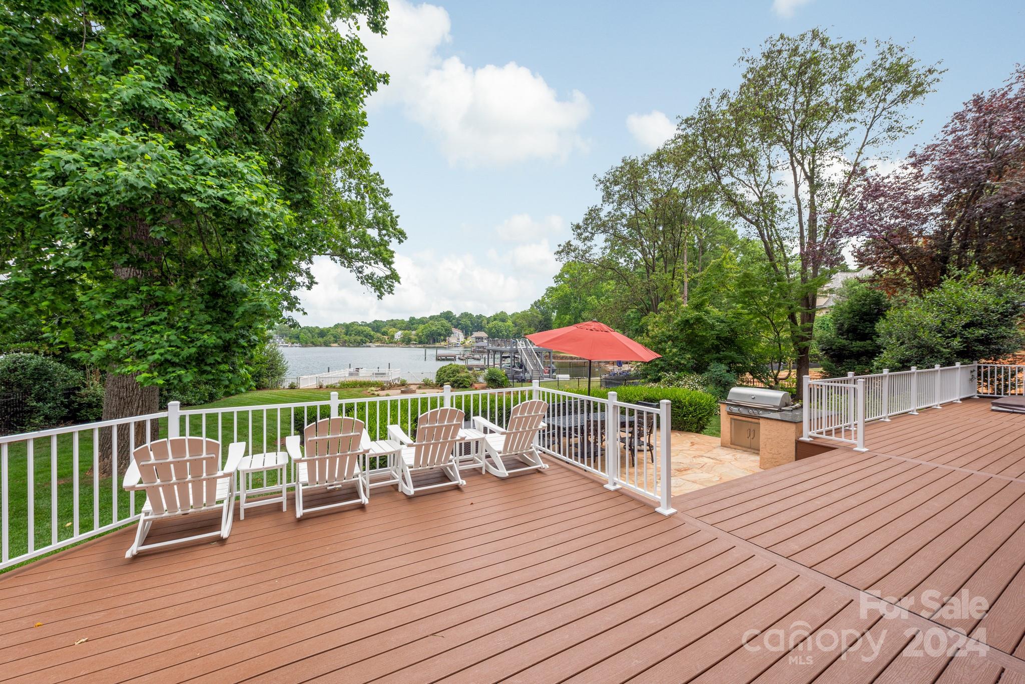 16711 Jetton Road Cornelius, NC 28031 - Photo 23 of 27 a view of a deck with furniture and wooden floor