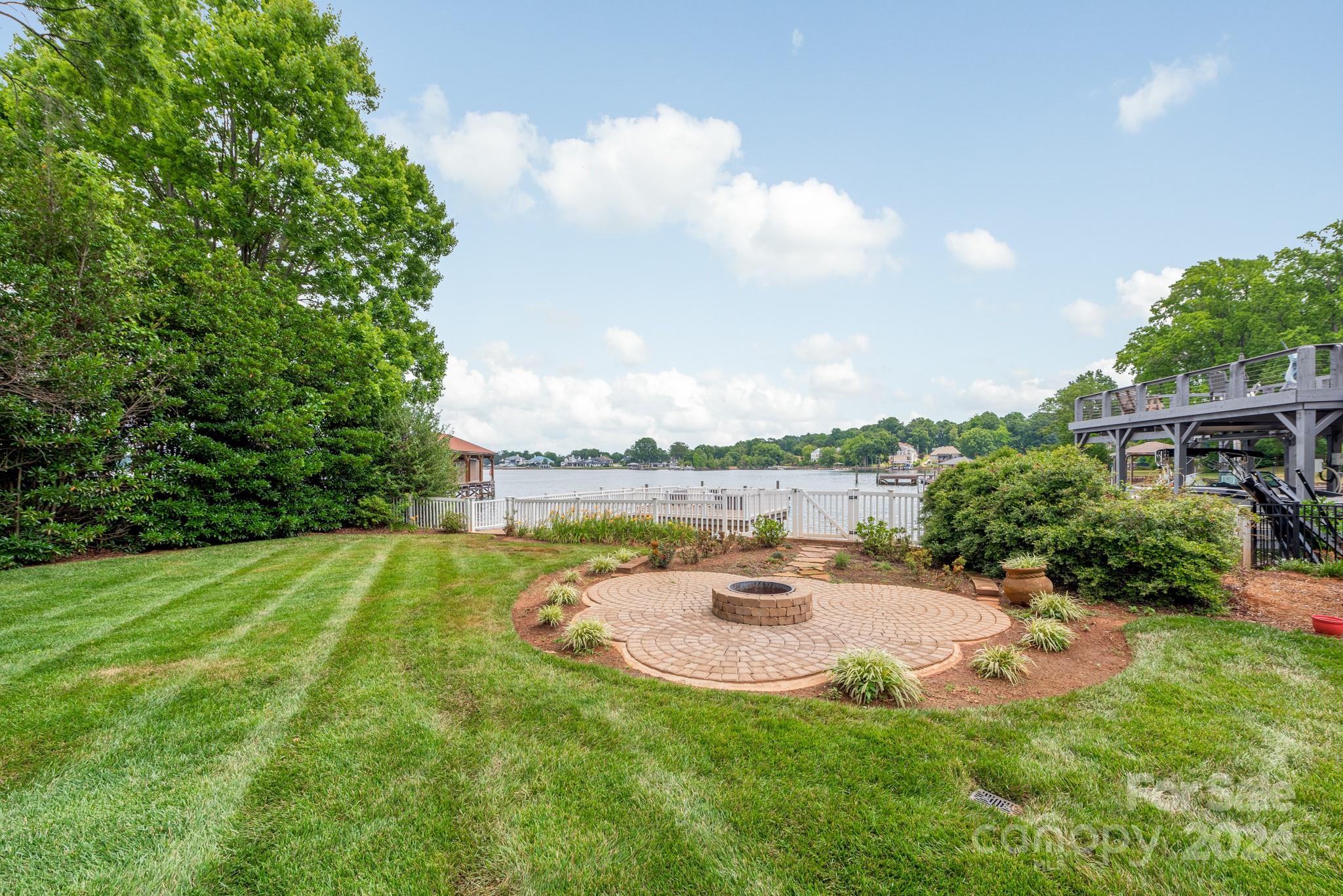 16711 Jetton Road Cornelius, NC 28031 - Photo 25 of 27 a view of a swimming pool with a patio and a yard
