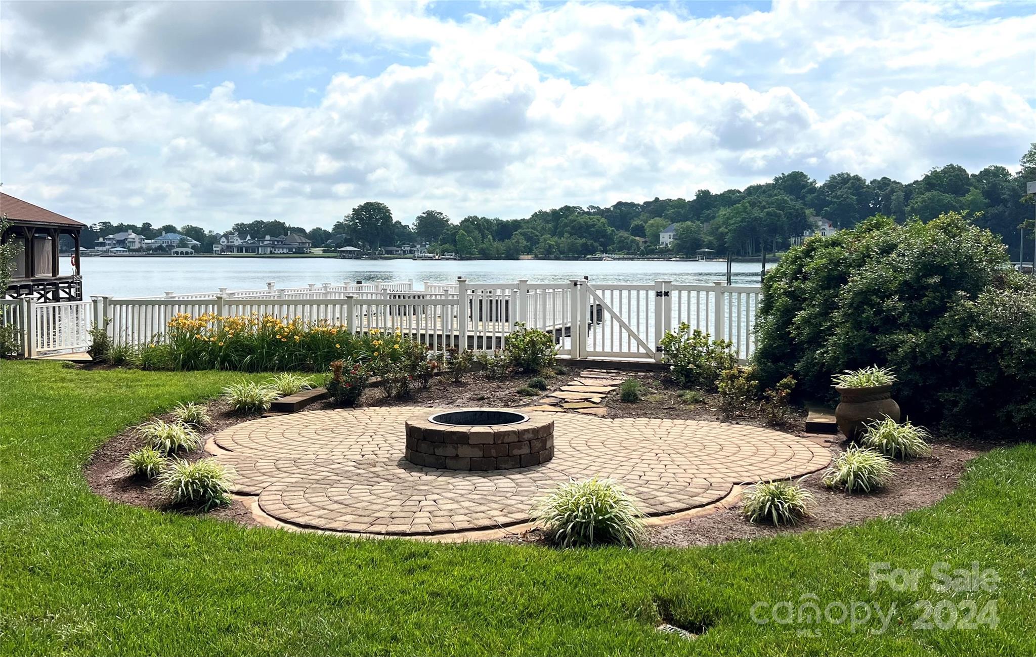 16711 Jetton Road Cornelius, NC 28031 - Photo 3 of 27 a view of a backyard with sitting area and lake view