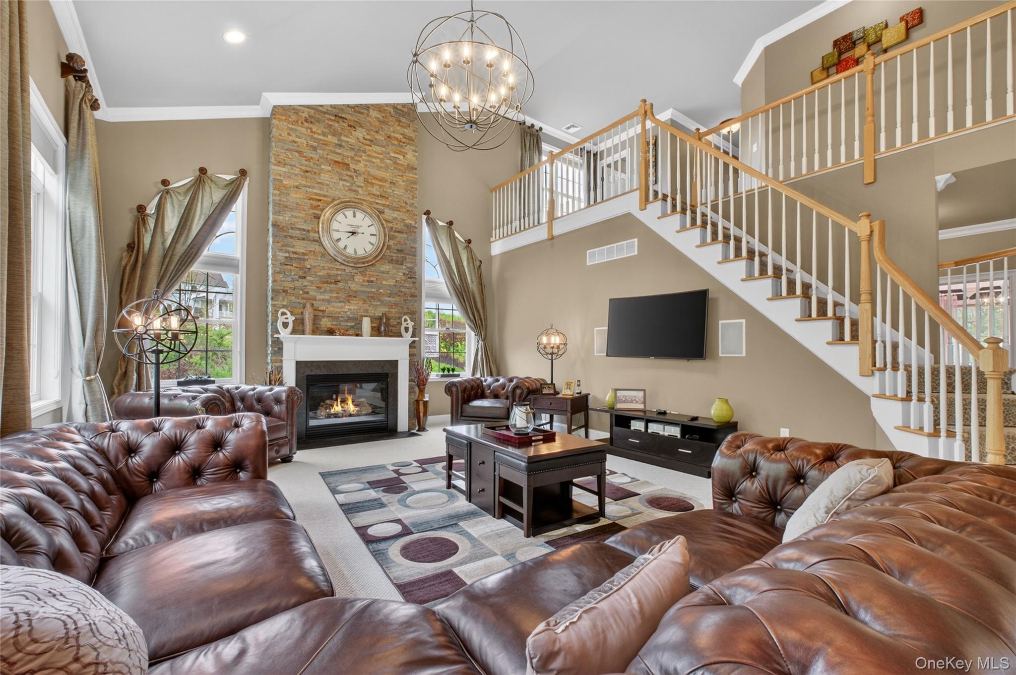 219 Country Club Road Hopewell Junction, NY 12533 - Photo 5 of 49 a living room with furniture a fireplace and a chandelier